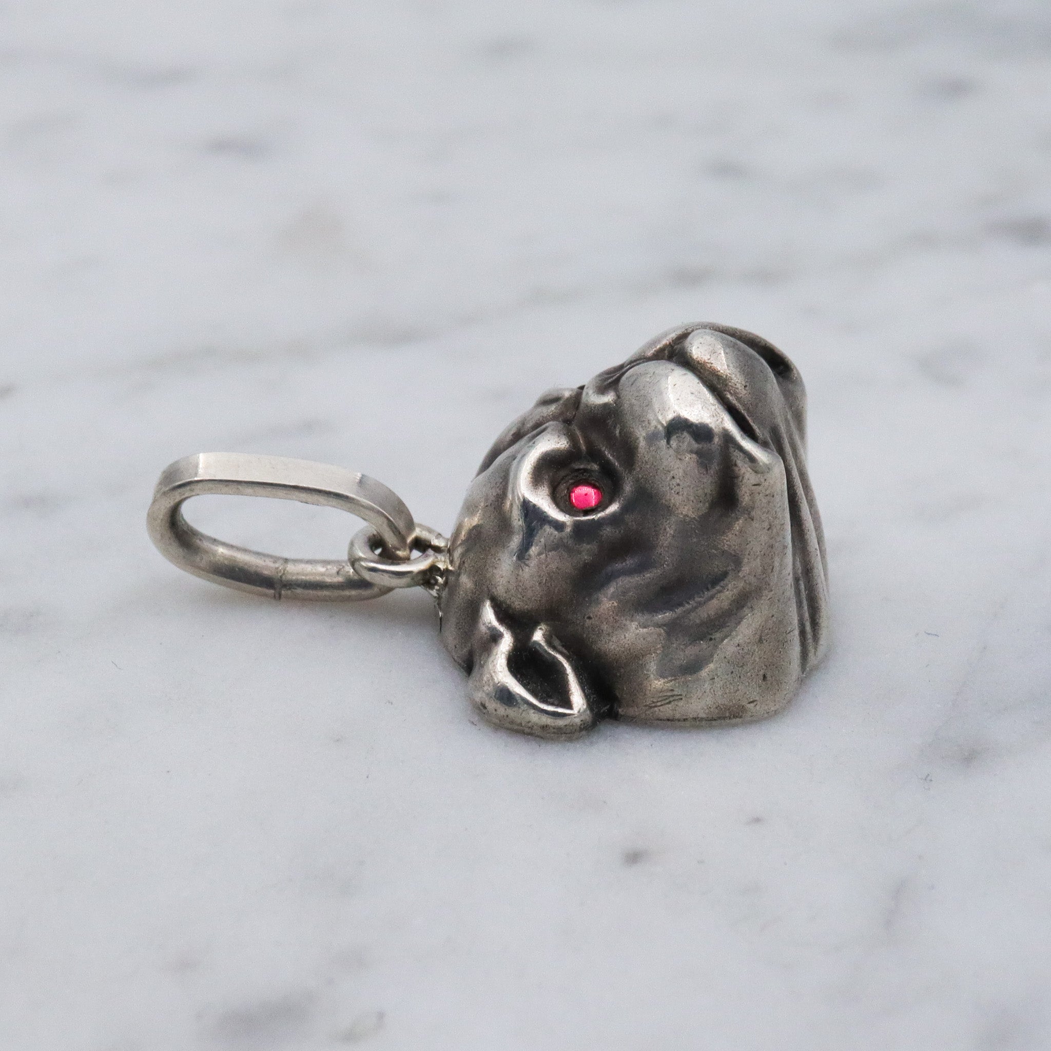 Antique Unger Brothers sterling silver bulldog with ruby glass eyes pendant